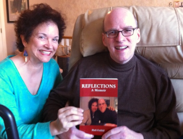Mark and Julia proudly holding Mark's memoirs, available on Amazon.